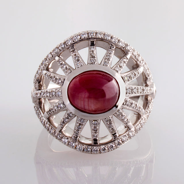In spectacular Art Deco inspired style Sprazzo di Sole's sunburst rays, adorned with diamonds, flaring from stunning star rubies. Jewellery designed by Biagio Patalano