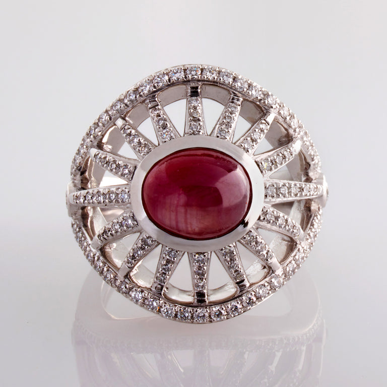 A solitaire cabochon star ruby ring with diamond studding spokes designed by Biagio Patalano for the Artistry collection 